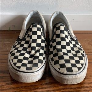 Black and white slip on checkered vans